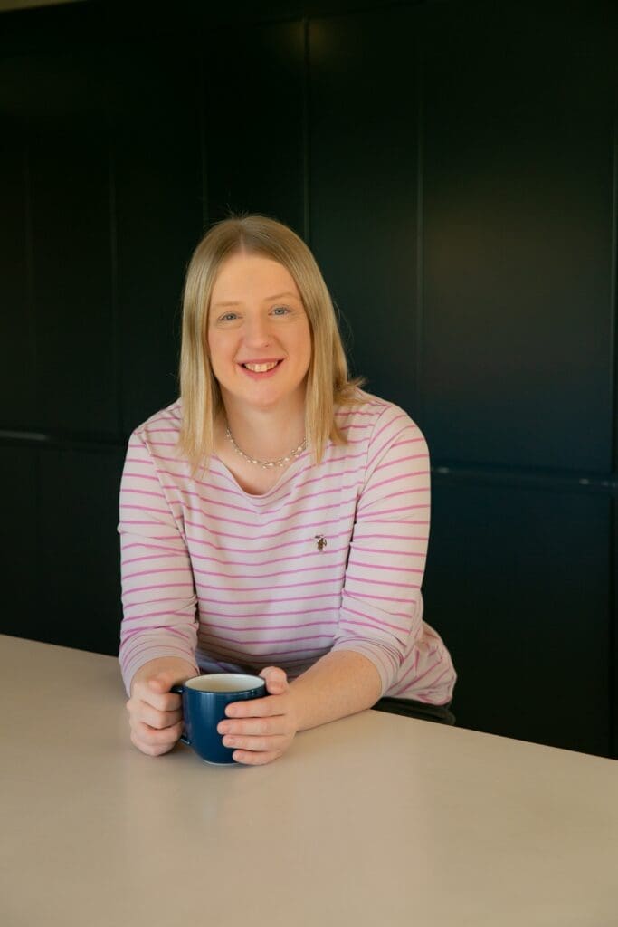 Image of Emily Hill holding a cup of tea